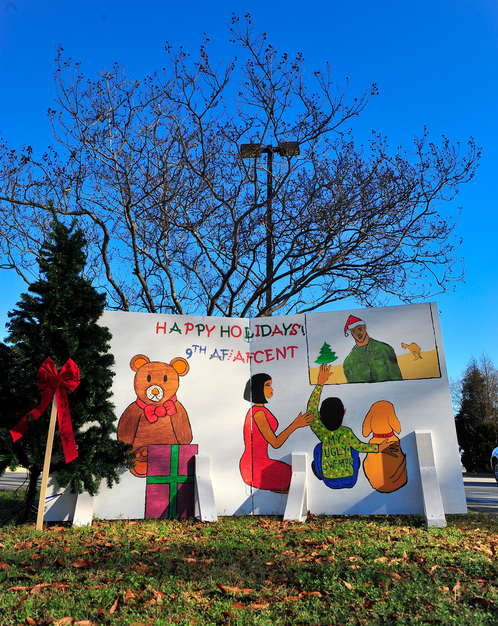 Air Force Central Command holiday card is displayed amongst squadron cards as a part of Shaw's Christmas card competition on Shaw Drive, Dec. 15, 2011, Shaw Air Force Base, S.C.. The holiday cards were created for seasonal spirit and squadron competition. (U.S. Air Force photo by Airman 1st Class Neil D. Warner)