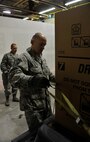 MINOT AIR FORCE BASE, N.D. – Master Sgt. Jesse Evans, 5th Operations Group first sergeant, loads a donated refrigerator for a family in need during Operation Homefront here Dec. 15. Operation Homefront and the Home Depot Foundation in coordination with Minot AFB’s Operation Warmheart and General Electric distributed 135 appliances to Team Minot Airmen and their families affected by the historic Souris River flood. (U.S. Air Force photo/Senior Airman Desiree Esposito)