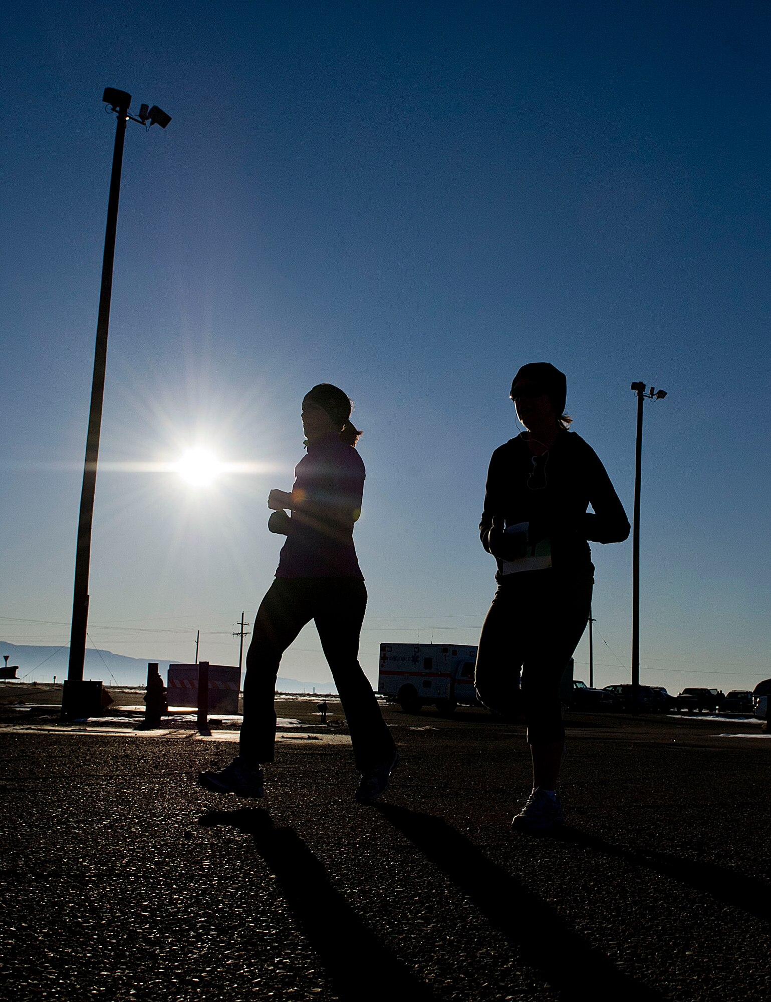HOLLOMAN AIR FORCE BASE, N.M. --Two participants in the High Speed Test Track Mach 10K run the second portion of the 10 km race Dec. 9, 2011, at the Holloman High Speed Test Track. The event, hosted by the 846th Test Squadron, offered Team Holloman runners a 5 km, 10 km and 10-mile race. (U.S. Air Force photo by Senior Airman DeAndre Curtiss / Released)