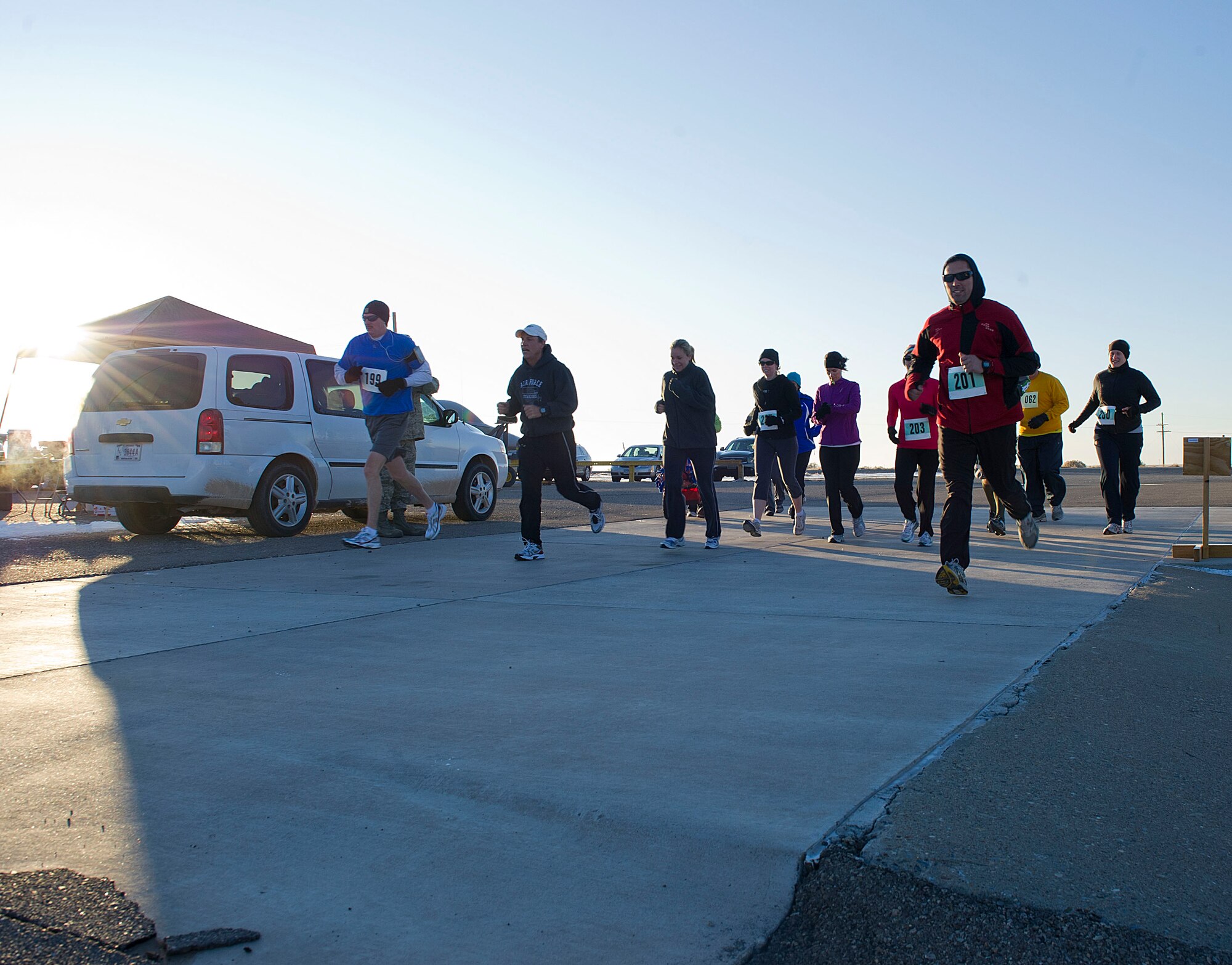 HOLLOMAN AIR FORCE BASE, N.M. -- Participants in the High Speed Test Track Mach 10K begin the 10 km race Dec. 9, 2011 at the Holloman High Speed Test Track. The event, hosted by the 846th Test Squadron, offered Team Holloman runners a 5 km, 10 km and 10-mile race. (U.S. Air Force photo by Senior Airman DeAndre Curtiss / Released)