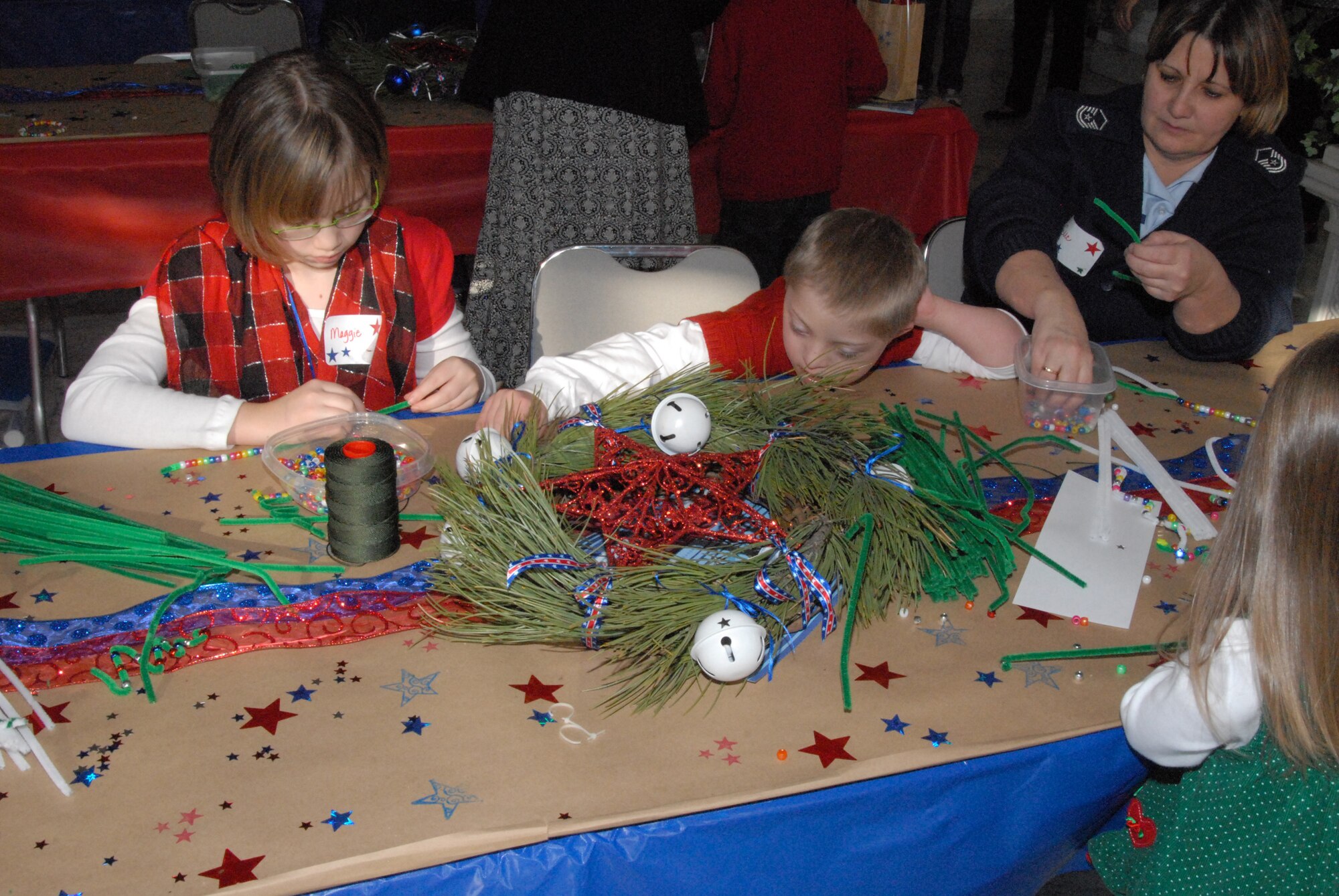A Colorado National Guard family enjoys crafts at the governor’s mansion Dec. 12, 2009, in Denver. (Official Colorado National Guard photo by Capt. Darin Overstreet)