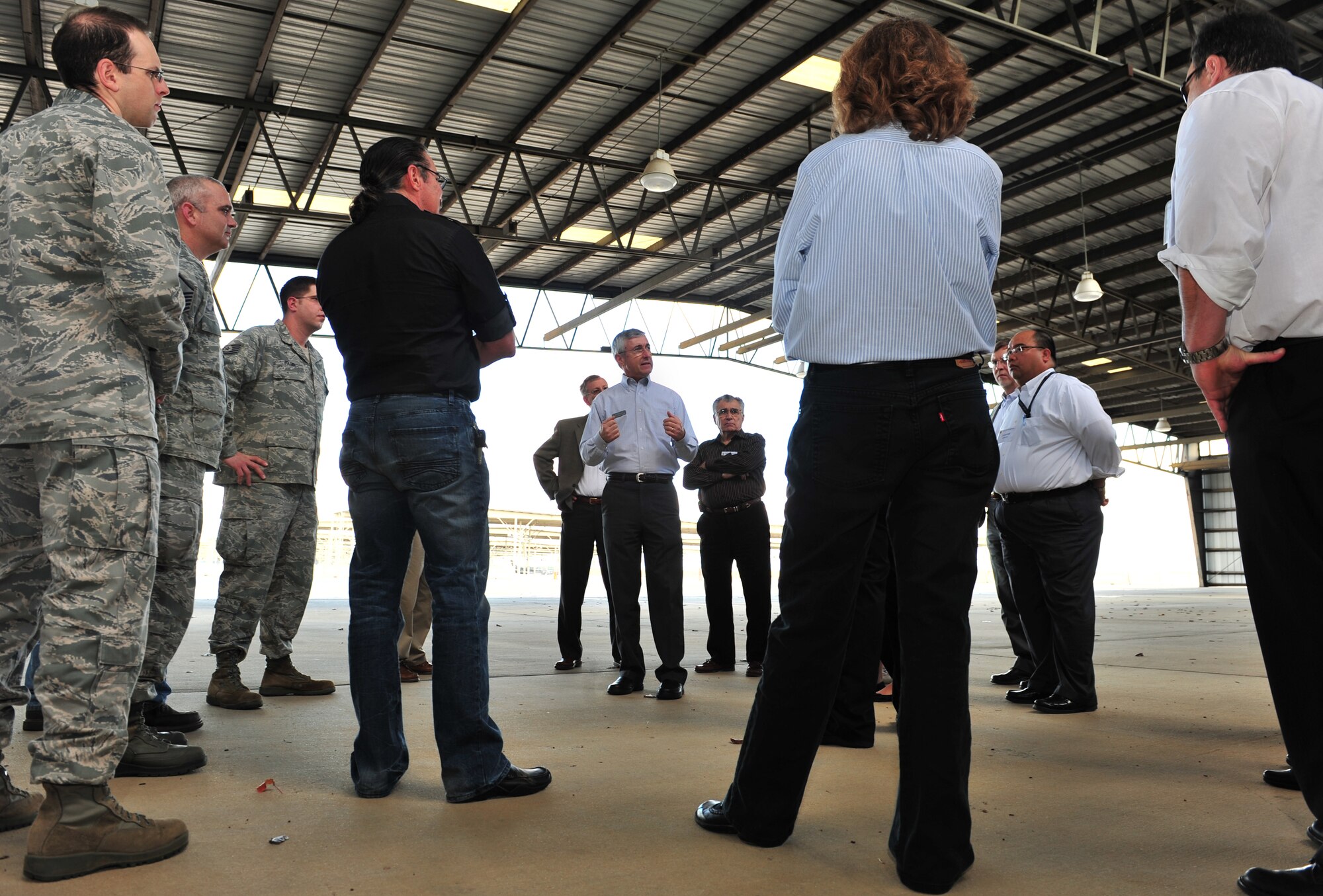 Rob Sexton, 20th Fighter Wing Public Affairs community relations manager, talks to members of the Restoration Advisory Board and Team Shaw about the 20th FW flightline Dec. 15, 2011, Shaw Air Force Base, S.C. The purpose of the workshop was to educate new community members of the RAB about Shaw’s mission and environmental matters. (U.S. Air Force photo by Senior Airman Amber E. N. Jacobs/Released)