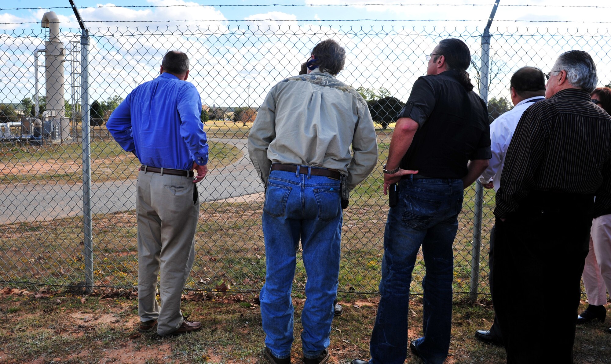 Members of the Restoration Advisory Board workshop view an extraction well Dec. 15, 2011, Shaw Air Force Base, S.C. The purpose of extraction wells are to remove possibly contaminated water and filter it, so it does not enter the water supply. (U.S. Air Force photo by Senior Airman Amber E. N. Jacobs/Released)