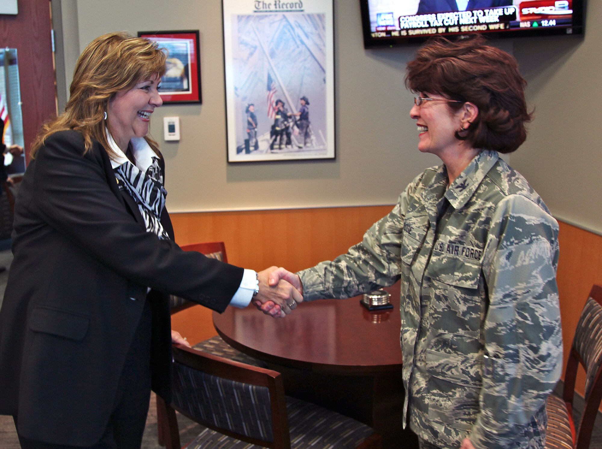 B.J. Nikkel, incumbent Colorado state representative, is greeted by Col. Pat Blassie, Air Reserve Personnel Center Commander, during the representative’s first visit to ARPC headquarters Dec. 16, 2011, on Buckley Air Force Base, Colo. Nikkel represents House District 49, which includes all of rural Larimer County, Colorado. She was appointed to the Colorado House of Representatives in January 2009. (U.S. Air Force photo/Quinn Jacobson)