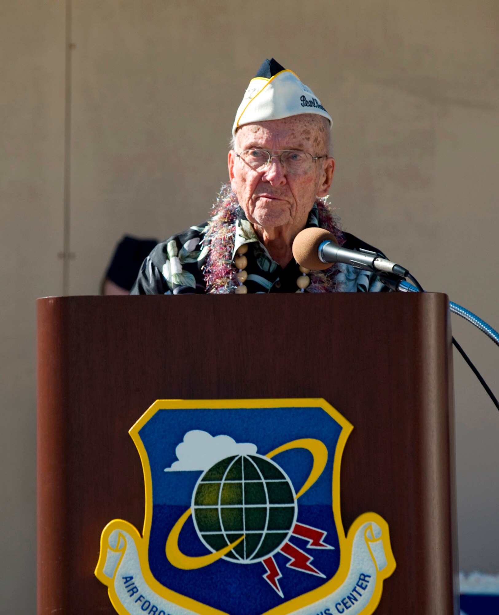 Retired U.S. Navy Capt. Richard P. Jeffrey gives the keynote speech during the Pearl Harbor Day Memorial Ceremony Dec. 7 at Patrick Air Force Base. The Air Force Technical Applications Center hosted the ceremony for the 17th consecutive year, paying tribute to Captain Jeffrey and three other U.S. servicemen and several surviving spouses who were all impacted by the 1941 Japanese attacks on Pearl Harbor. (U.S. Air Force photo/Julie Dayringer)