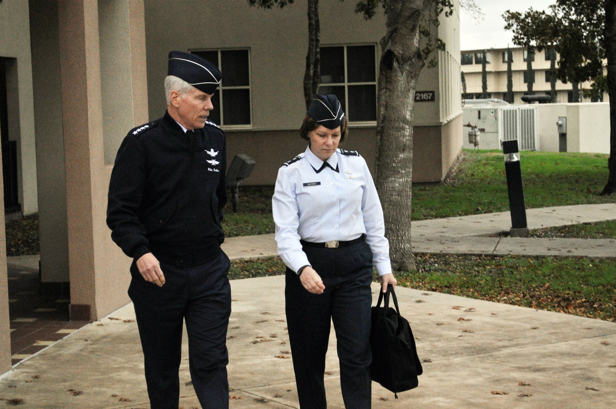 Gen. William Shelton, Air Force Space Command commander, talks with Maj. Gen. Suzanne Vautrinot, 24th Air Force commander, during his visit to Air Forces Cyber at Lackland Air Force Base Dec. 15. (U.S. Air Force photo by Tech. Sgt. Scott McNabb)