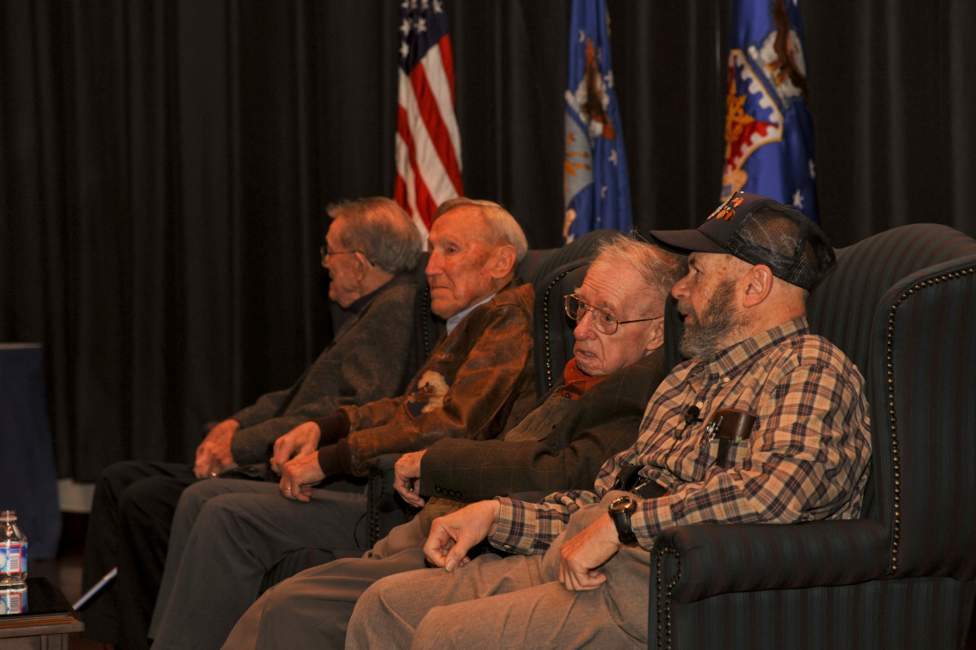 Retired U.S. Army Master Sgt. Lloyd Orth speaks with former U.S. Army Sgt. Arthur Goldschmidt during a panel featuring veterans of the Battle of the Bulge at the U.S. Air Force Expeditionary Center Dec. 15.  (U.S. Air Force photo by Tech. Sgt. Zachary Wilson/Released.) 