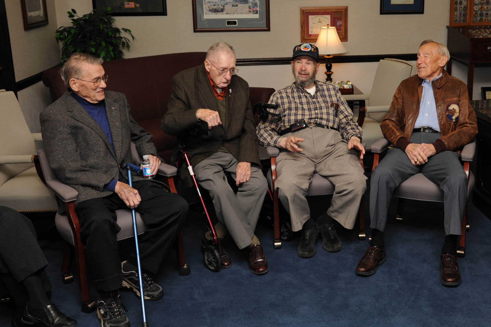 Four veterans of World War II's Battle of the Bulge visited the U.S. Air Force Expeditionary Center Dec. 15 as part of a panel of the historic battle. From left: U.S. Army Col. (ret) John Maher, U.S. Army Master Sgt. (ret) Lloyd Orth, and U.S. Air Force Lt.Col. (ret) Bob Hansen spent time with Maj. Gen. William Bender, U.S. Air Force Expeditionary Center commander prior to the event's start. (U.S. Air Force photo by Tech. Sgt. Zachary Wilson/Released.) 