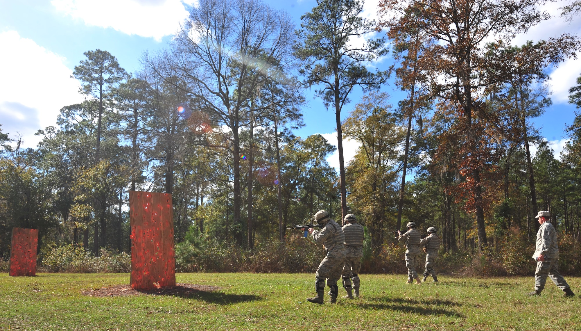 Students going through an air liaison officer assessment course are taught how to fire simulation rounds at targets while walking in a line formation. The students were also taught about weapon control and safety during the course. (U.S. Air Force photo by Staff Sgt. Stephanie Mancha/ Released)   
