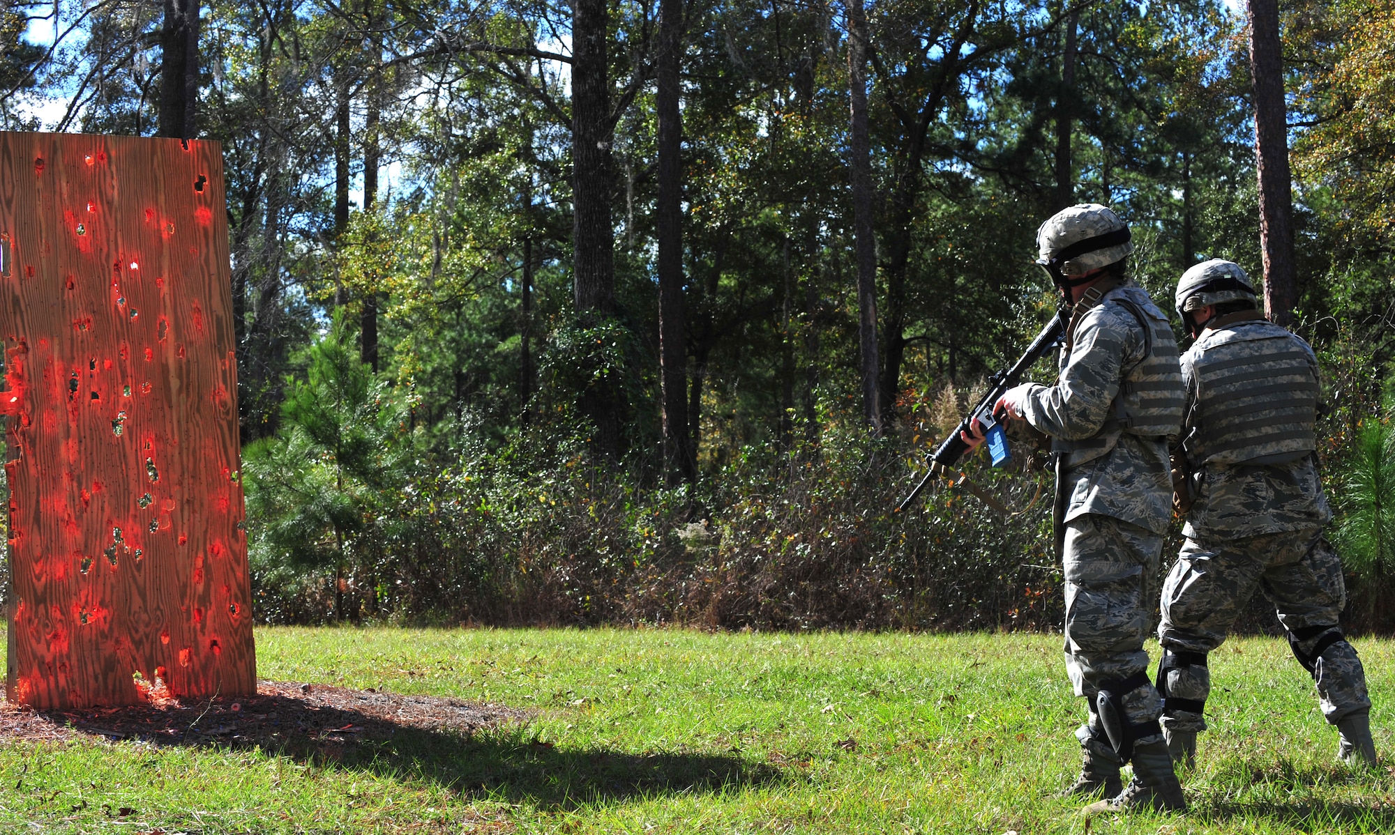 Students going through an air liaison officer assessment course practice firing at a target at Moody Air Force Base, Ga., Dec. 15, 2011. The skills practiced during the drill was later used while clearing buildings during the military operations on urban terrain portion of the course. ( U.S. Air Force photo by Staff Sgt. Stephanie Mancha/Released)