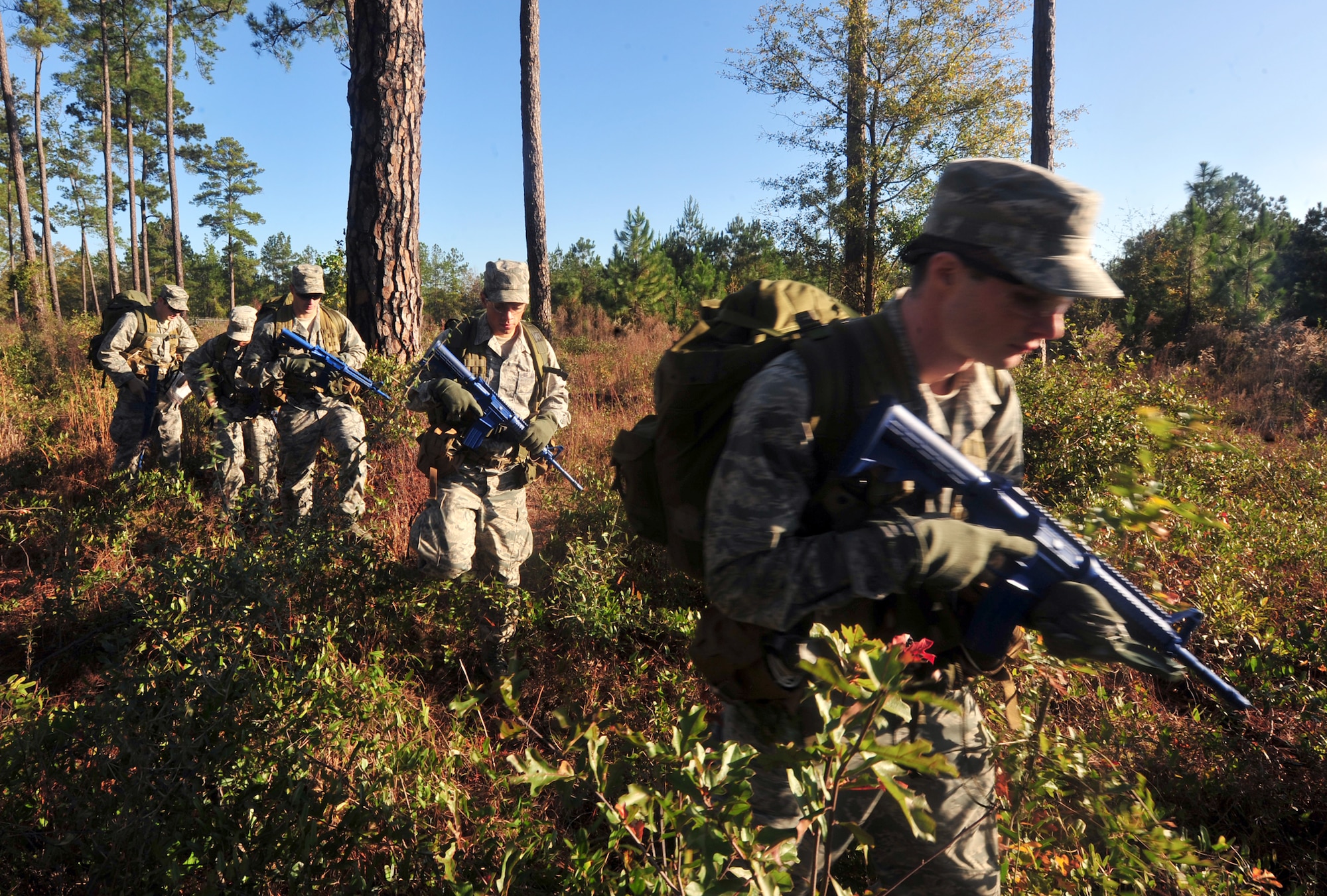 Students going through an air liaison officer assessment course practice land navigation through the woods at Moody Air Force Base, Ga., Dec. 13, 2011. Thirty-two students participated in the ALO course in hopes of making it through and continuing on. (U.S. Air Force photo by Staff Sgt. Stephanie Mancha/Released)