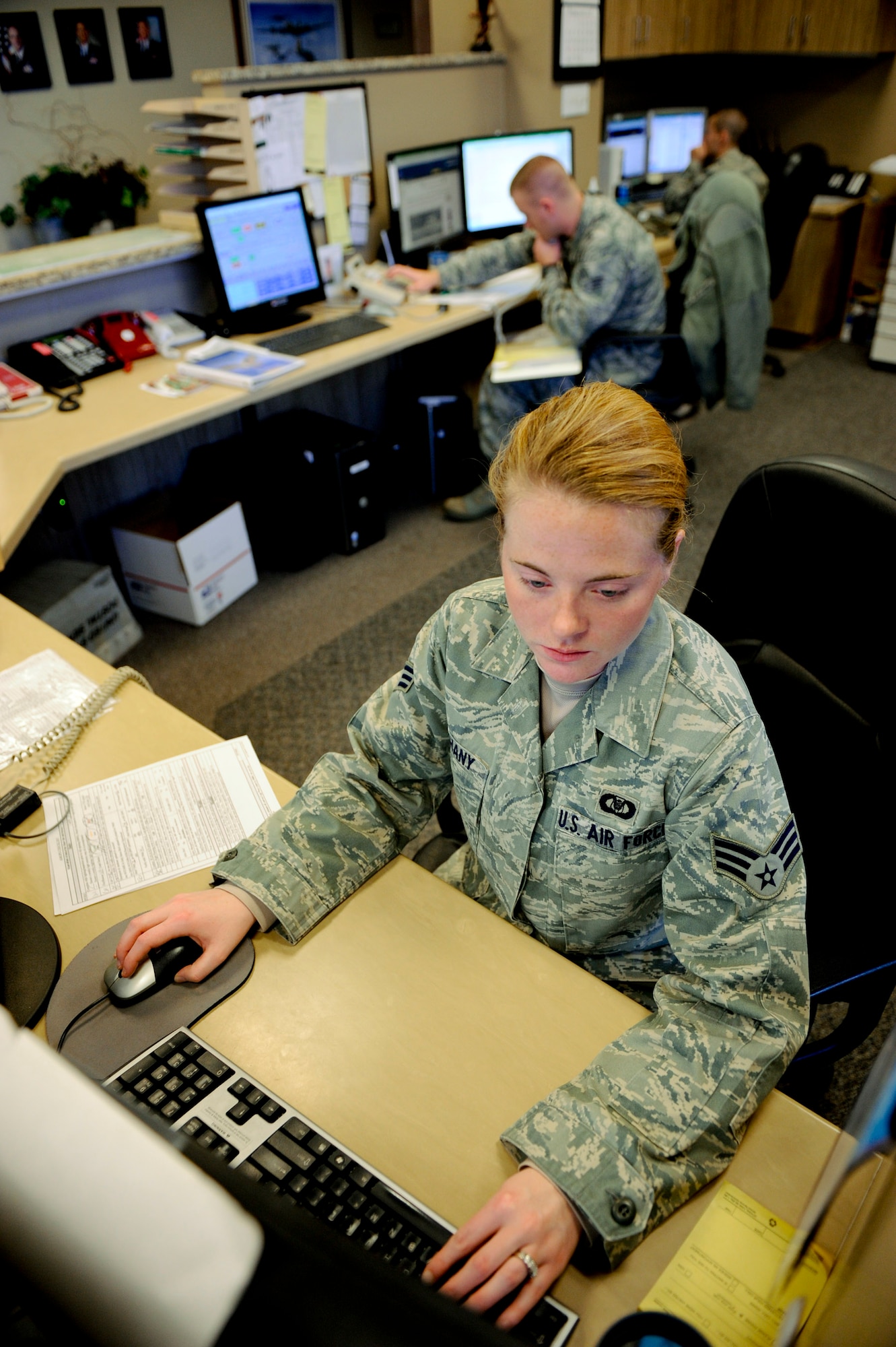 VANDENBERG AIR FORCE BASE, Calif. - Senior Airman Kristin Bethany, a 30th Operations Support Squadron airfield manager, performs the daily radio check here Tuesday, Dec. 13, 2011. The Airfield Management team reviews everything from broken equipment and cracks in the flightline to ensure that the airfield is ready to support operations at all times. (U.S. Air Force/Staff Sgt. Levi Riendeau)
