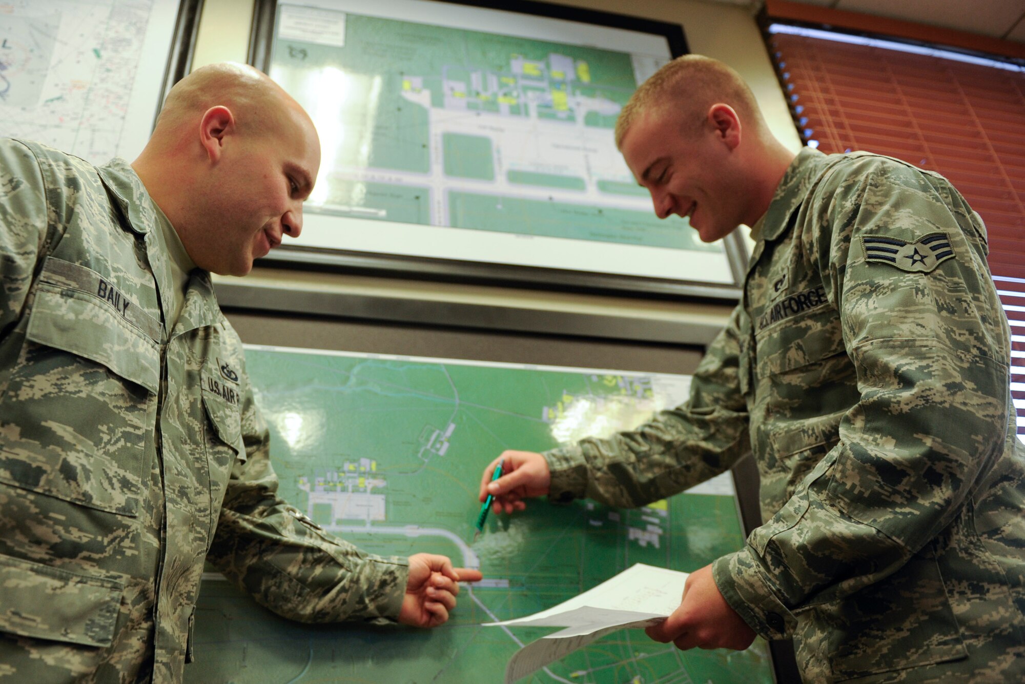 VANDENBERG AIR FORCE BASE, Calif. - Tech. Sgt. Donald Baily and Senior Airman Christopher McComus, both 30th Operations Support Squadron airfield managers, speak after the morning flightline inspection about bird sighting on the runway here Tuesday, Dec. 13, 2011. The Airfield Management team documents wildlife and works closely with the base conservation office to ensure the animals stay off of the runway. (U.S. Air Force/Staff Sgt. Levi Riendeau)
