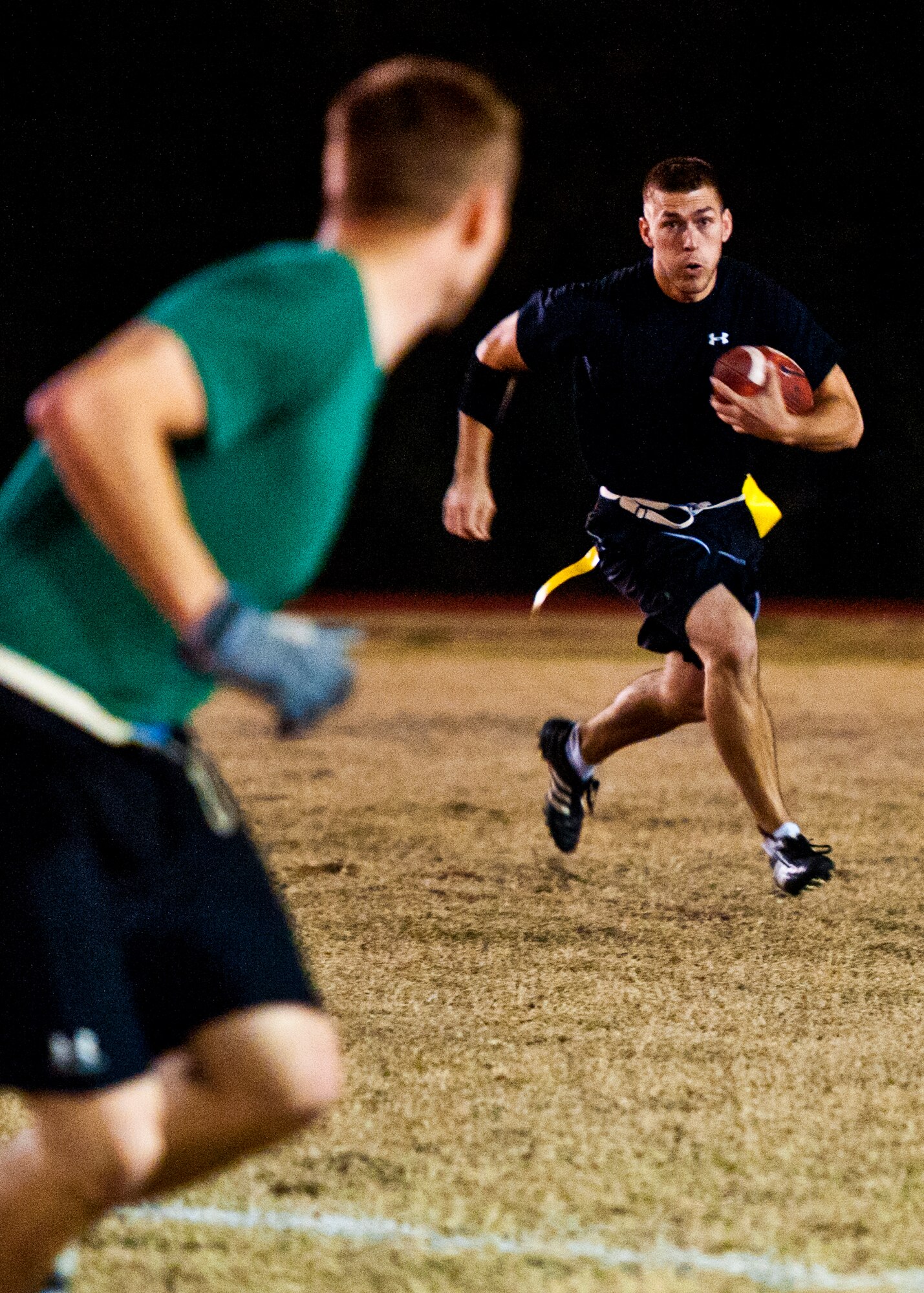 Zerrick Haymond, a 96th Security Forces Squadron wide receiver, catches a pass at the goal line over Air Armament Center’s Jimmy Herold, during the base intramural flag football championship game Dec. 15 at Eglin Air Force Base, Fla.  SFS beat the Air Armament Center team 19-14 to claim the title.  It had been three years since they’d been the champs.  (U.S. Air Force photo/Samuel King Jr.)
