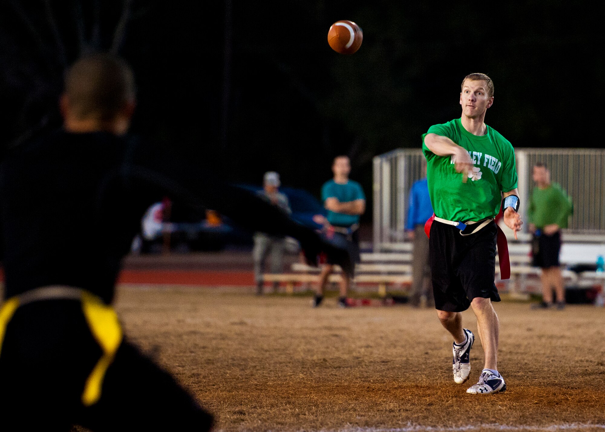 Brian Nagle, the Air Armament Center quarterback, tosses a pass to an open teammate during the base intramural flag football championship game against the 96th Security Forces Squadron Dec. 15 at Eglin Air Force Base, Fla.  SFS beat the Air Armament Center team 19-14 to claim the title.  It had been three years since they’d been the champs.  (U.S. Air Force photo/Samuel King Jr.)