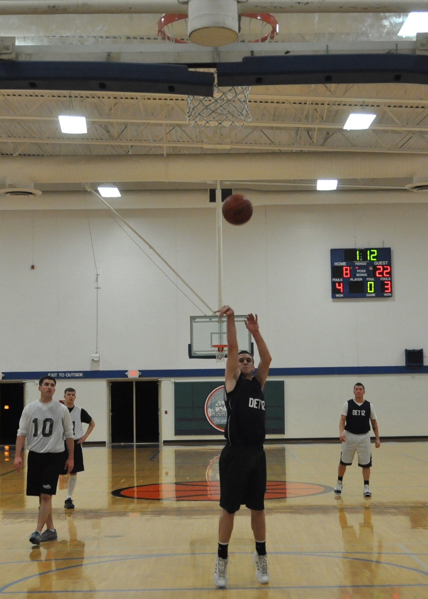 An Airman from the 373rd Training Squadron Det. 12 attempts a foul shot during the first game of a four-day intramural basketball tournament Dec. 8, 2011, at Joint Base Lewis-McChord, Wash. The tournament was comprised of eight McChord Field teams. (U.S. Air Force photo/Airman 1st Class Leah Young) 
