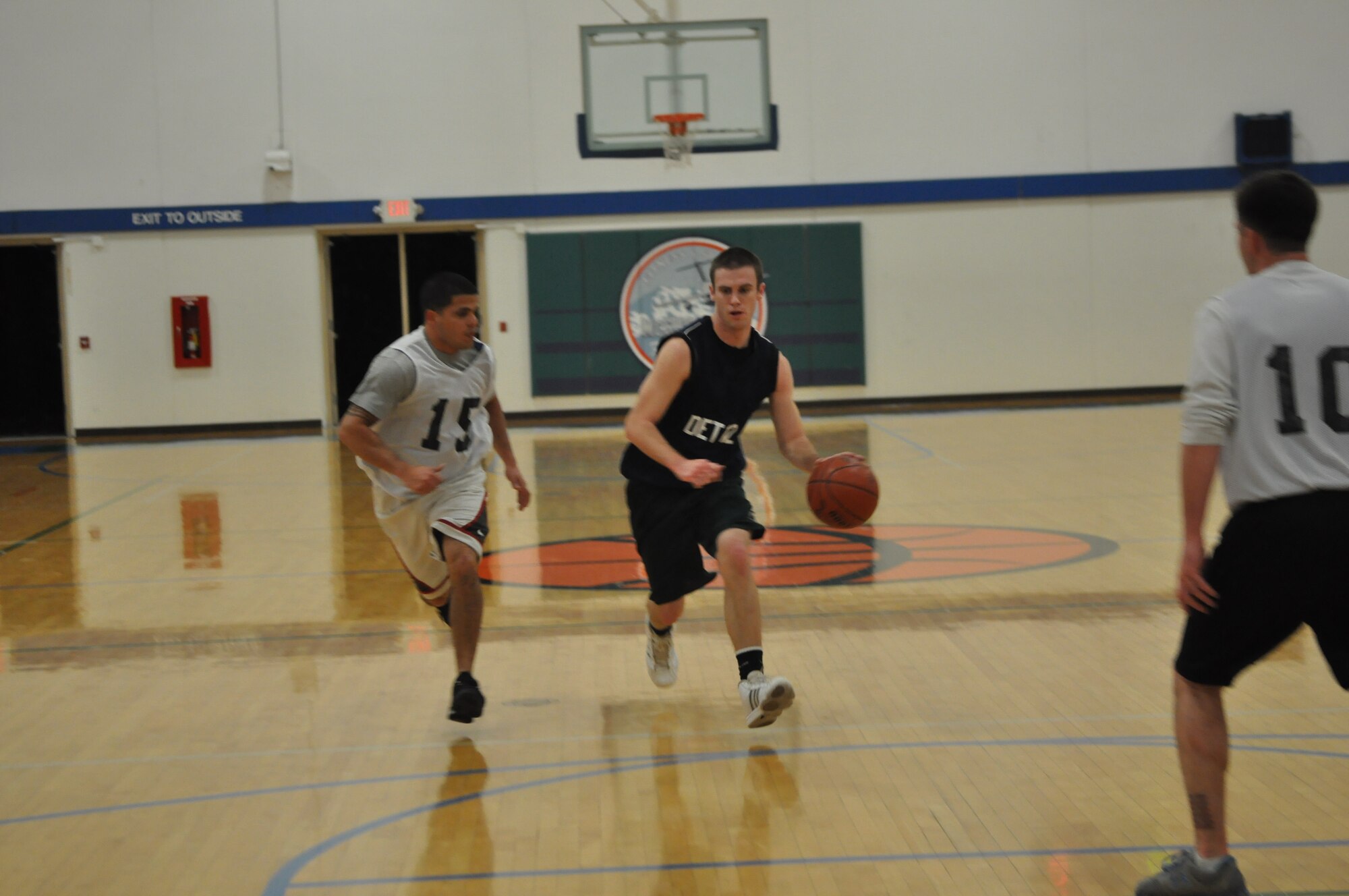 The 373rd Training Squadron Det. 12 faces the 627th Security Forces Squadron during the first game of a four-day intramural basketball tournament Dec. 8, 2011, at Joint Base Lewis-McChord, Wash. “We have a pretty good team this year,” said Tech. Sgt. Henry Moultrie, 373rd TRS instructor and intramural participant for the past eight years. “Last year we went 7 and 1, so hopefully we can repeat that and go all the way.” (U.S. Air Force photo/Airman 1st Class Leah Young) 