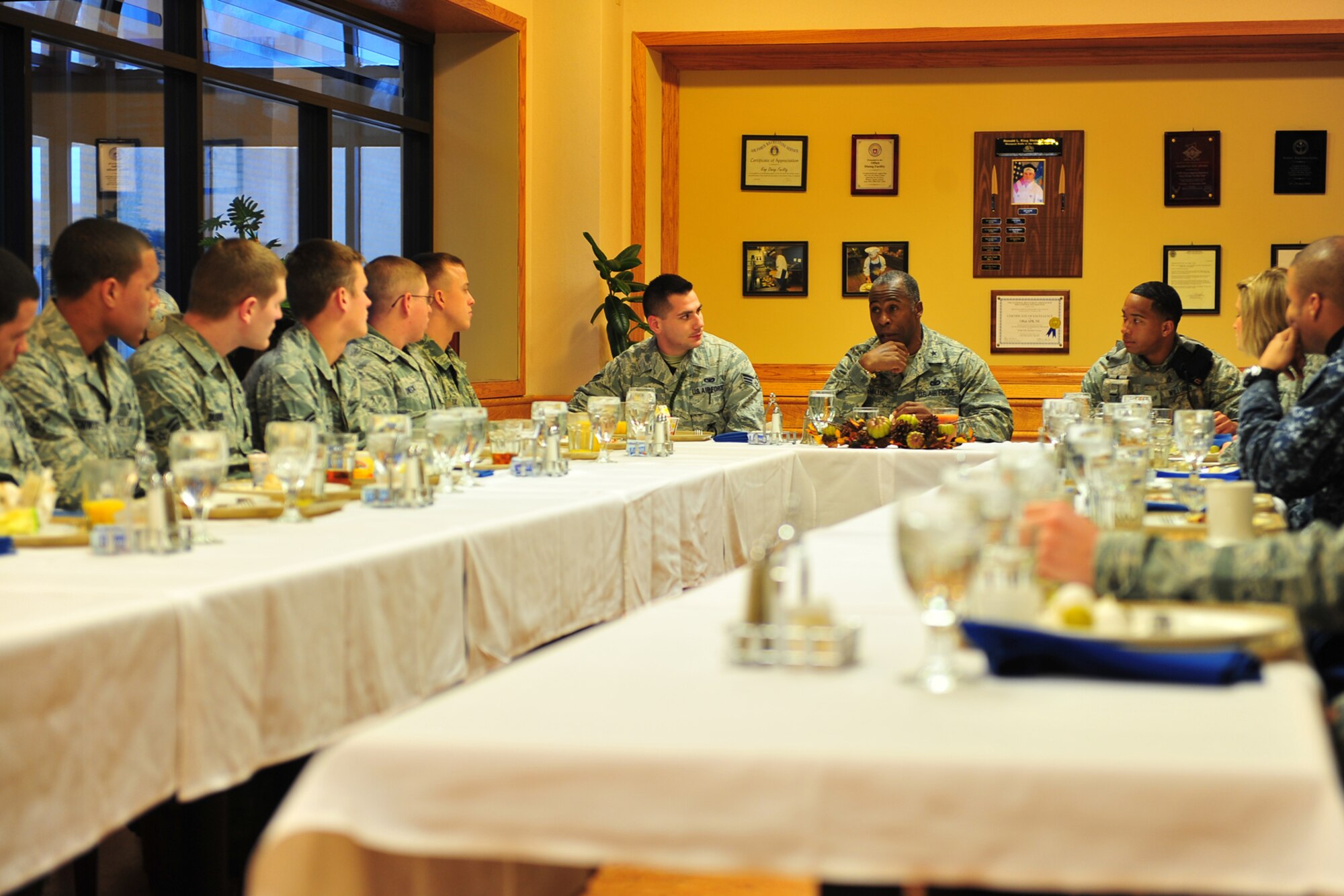 U.S. Air Force Brig. Gen. Jimmy McMillian, Air Force director of Security Forces, discusses changes to the security forces battle gear during breakfast inside the Ronald L. King Dining Facility on Offutt Air Force Base, Neb., Dec. 08. McMillian provides policy and oversight for protecting Air Force resources from terrorism, criminal acts, sabotage and acts of war.

(U.S. Air Force Photo by Charles Haymond/Released). 