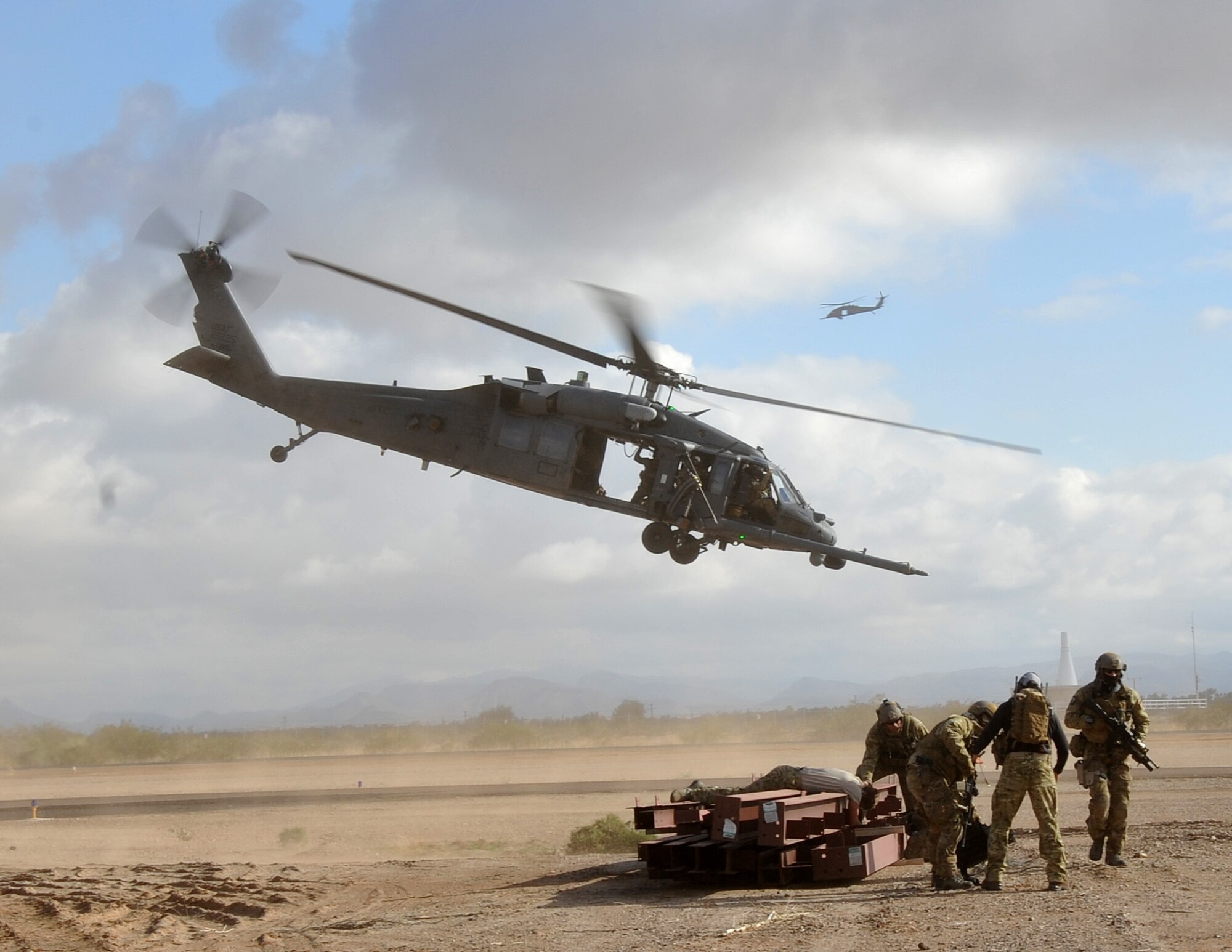A HH-60G Pave Hawk helicopter with the 943rd Rescue Group takes off after dropping off pararescuemen during a mass causality drill during the Operation Shocker training exercise. The exercise tested the 943rd Rescue Group’s ability to respond to a variety of combat-search-and-rescue scenarios prior to an upcoming deployment. (U.S. Air Force Photo/ Master Sgt. Luke Johnson)