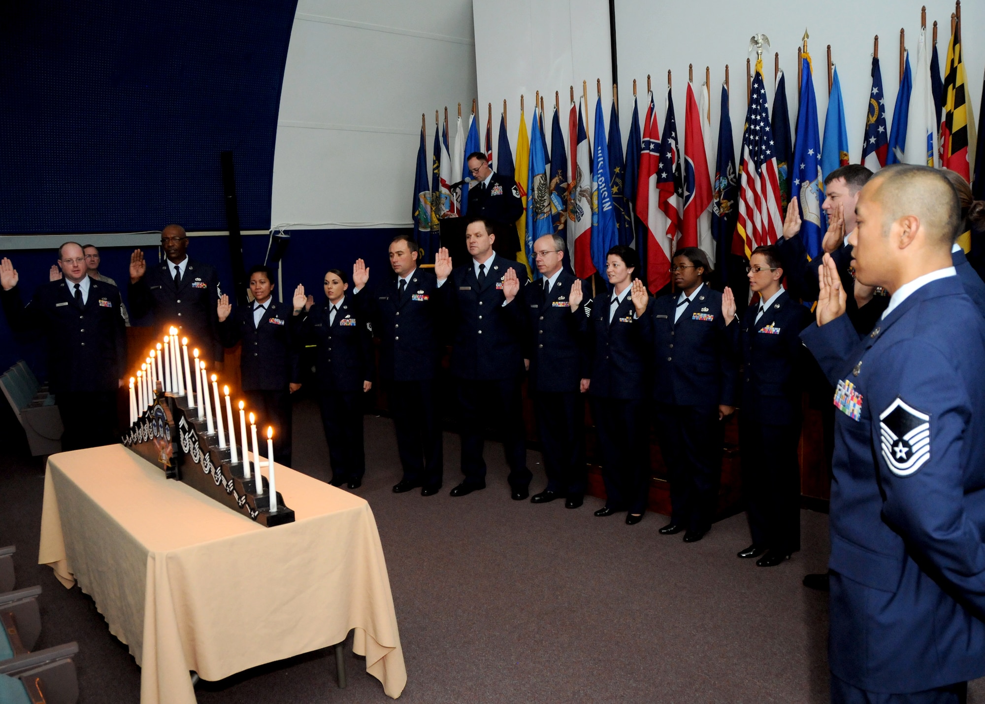 Newly promoted master sergeants recite the Senior NCO Oath during the 919th Special Operations Wing’s recent combined Senior NCO and NCO induction ceremony at Duke Field, Fla.   The formal ceremony honors wing reservists entering the top two tiers of enlisted leadership and signifies their  acceptance of increased responsibilities as new Senior NCOs and NCOs. (U.S. Air Force photo/Tech. Sgt. Cheryl Foster)