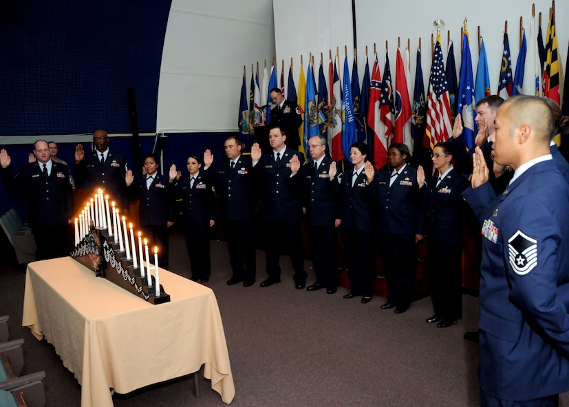 Newly promoted master sergeants recite the Senior NCO Oath during the 919th Special Operations Wing’s recent combined Senior NCO and NCO induction ceremony at Duke Field, Fla.   The formal ceremony honors wing reservists entering the top two tiers of enlisted leadership and signifies their  acceptance of increased responsibilities as new Senior NCOs and NCOs. (U.S. Air Force photo/Tech. Sgt. Cheryl Foster)