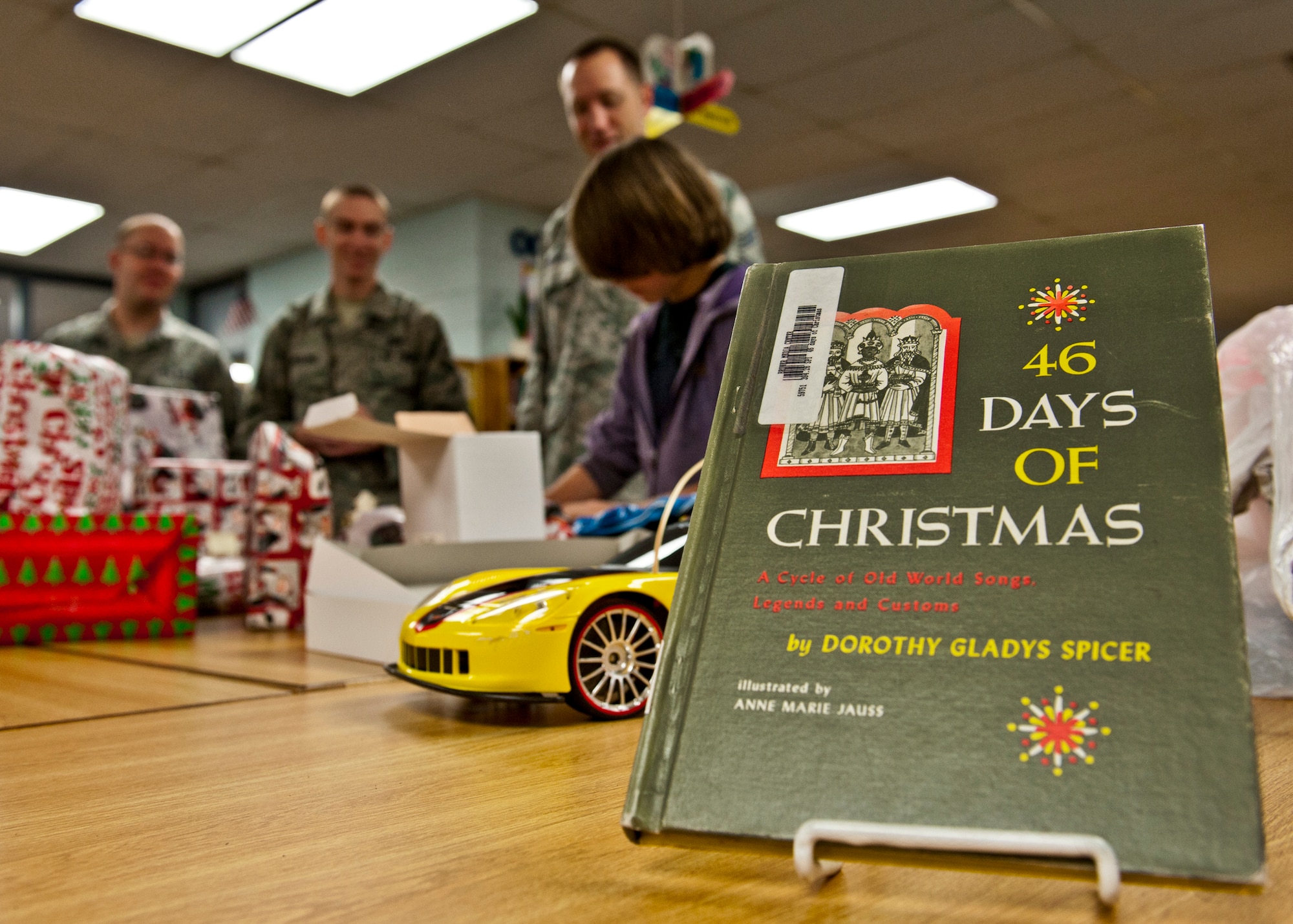 The 46th Test Wing’s operations group adopted 14 needy families from Bruner Middle School and provided them with food and gifts for the holidays.  (U.S. Air Force photo/Samuel King Jr.)