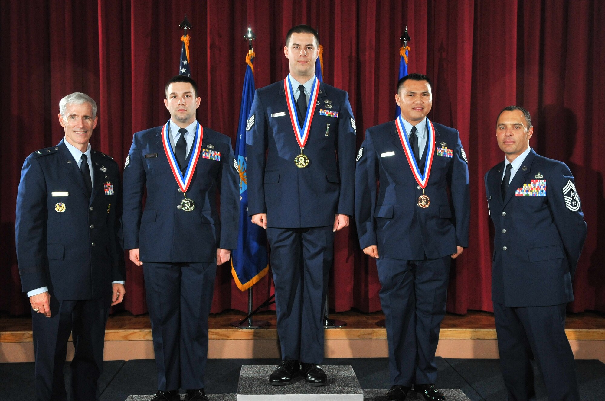 Staff Sgt. Justin Thomas of the 102nd Intelligence Support Squadron receives a gold medal from Air Force ISR Agency Commander, Maj. Gen. Bob Otto Oct. 27, during the Maj. Gen. Doyle E. Larson Awards banquet at Lackland Air Force Base, Texas. The coveted competition identifies, recognizes and honors the “Best of the Best” performers in 25 job specialties found at cryptologically-linked and administratively supported units from active duty Air Force, Air Force Reserves and Air National Guard.  Out of over 600 other competitors, Staff Sgt. Thomas was the only Guardsman to place as a finalist, taking home a Gold medal in the Client Systems career field (3D1X1). (U.S. Air Force photos by Mr. William Belcher/Released)