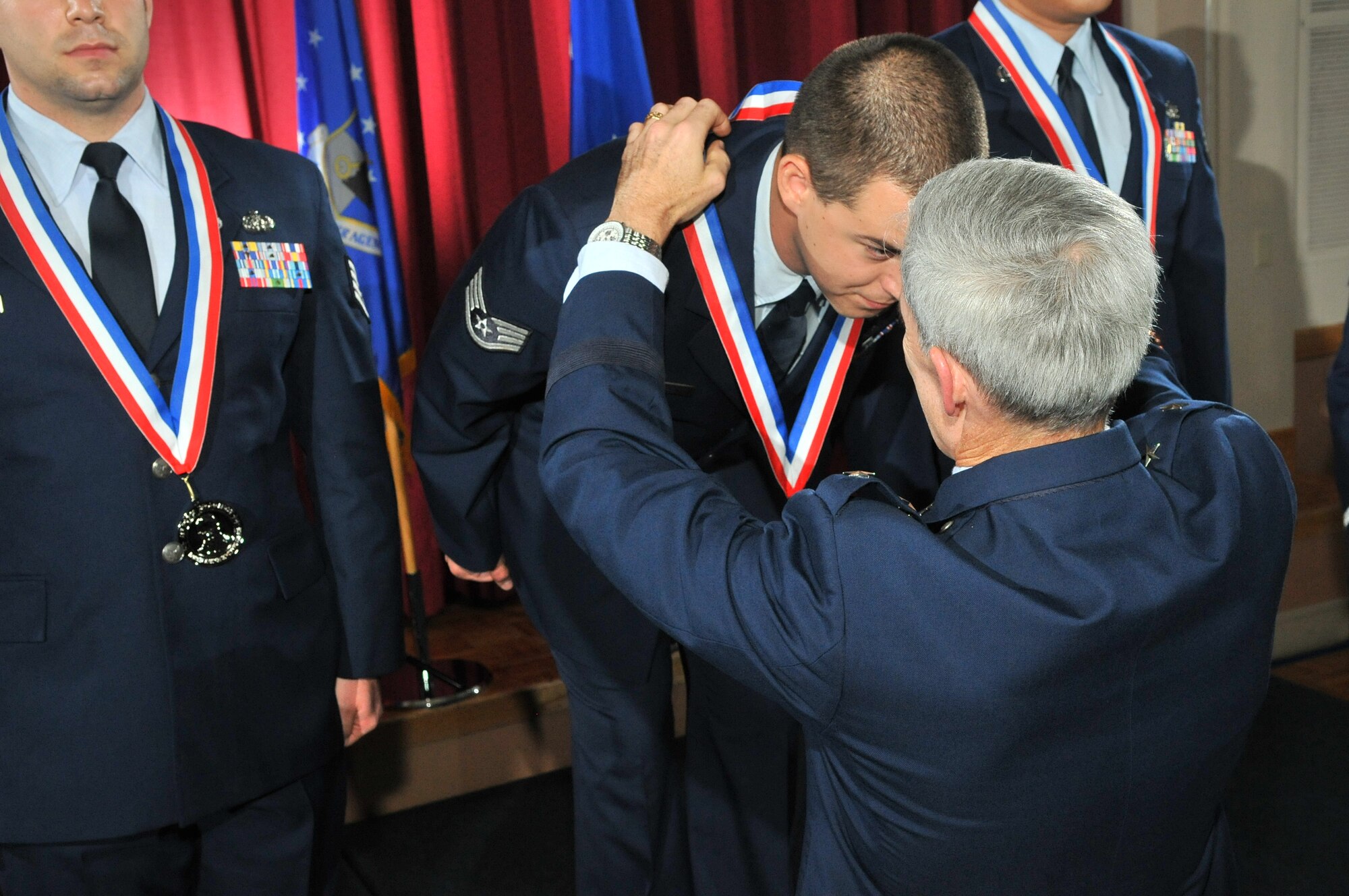 Staff Sgt. Justin Thomas of the 102nd Intelligence Support Squadron receives a gold medal from Air Force ISR Agency Commander, Maj. Gen. Bob Otto Oct. 27, during the Maj. Gen. Doyle E. Larson Awards banquet at Lackland Air Force Base, Texas. The coveted competition identifies, recognizes and honors the “Best of the Best” performers in 25 job specialties found at cryptologically-linked and administratively supported units from active duty Air Force, Air Force Reserves and Air National Guard.  Out of over 600 other competitors, Staff Sgt. Thomas was the only Guardsman to place as a finalist, taking home a Gold medal in the Client Systems career field (3D1X1). (U.S. Air Force photos by Mr. William Belcher/Released)