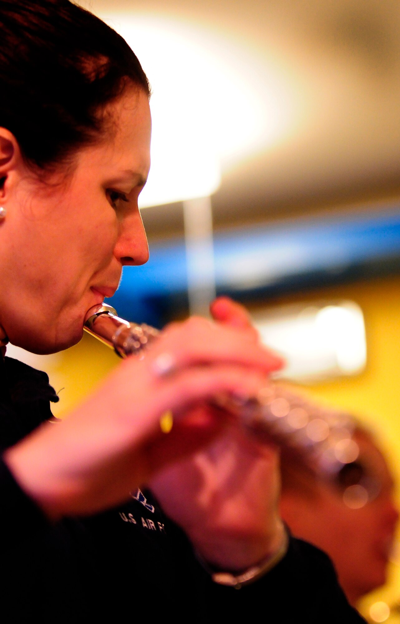 Tech. Sgt. Shannon Dooley, U.S. Air Forces in Europe Band Winds Aloft Woodwind quintet member, plays the clarinet Dec. 16  at a nursing home in San Quirino, Italy. The band members played holiday music for Team Aviano and local community members Dec.14-16 as part of a community relations tour celebrating the holidays. (U.S. Air Force photo/Airman 1st Class Briana Jones)