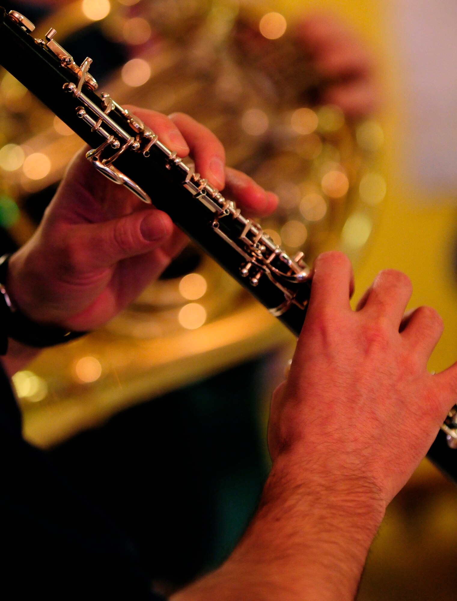 A U.S. Air Forces in Europe Band Winds Aloft Woodwind quintet member plays the oboe at a nursing home Dec.16 in San Quirno, Italy. The ensemble serenaded Team Aviano and local community members Dec. 14-16 as part of a community relations tour celebrating the holidays. (U.S. Air Force photo/Airman 1st Class Briana Jones)