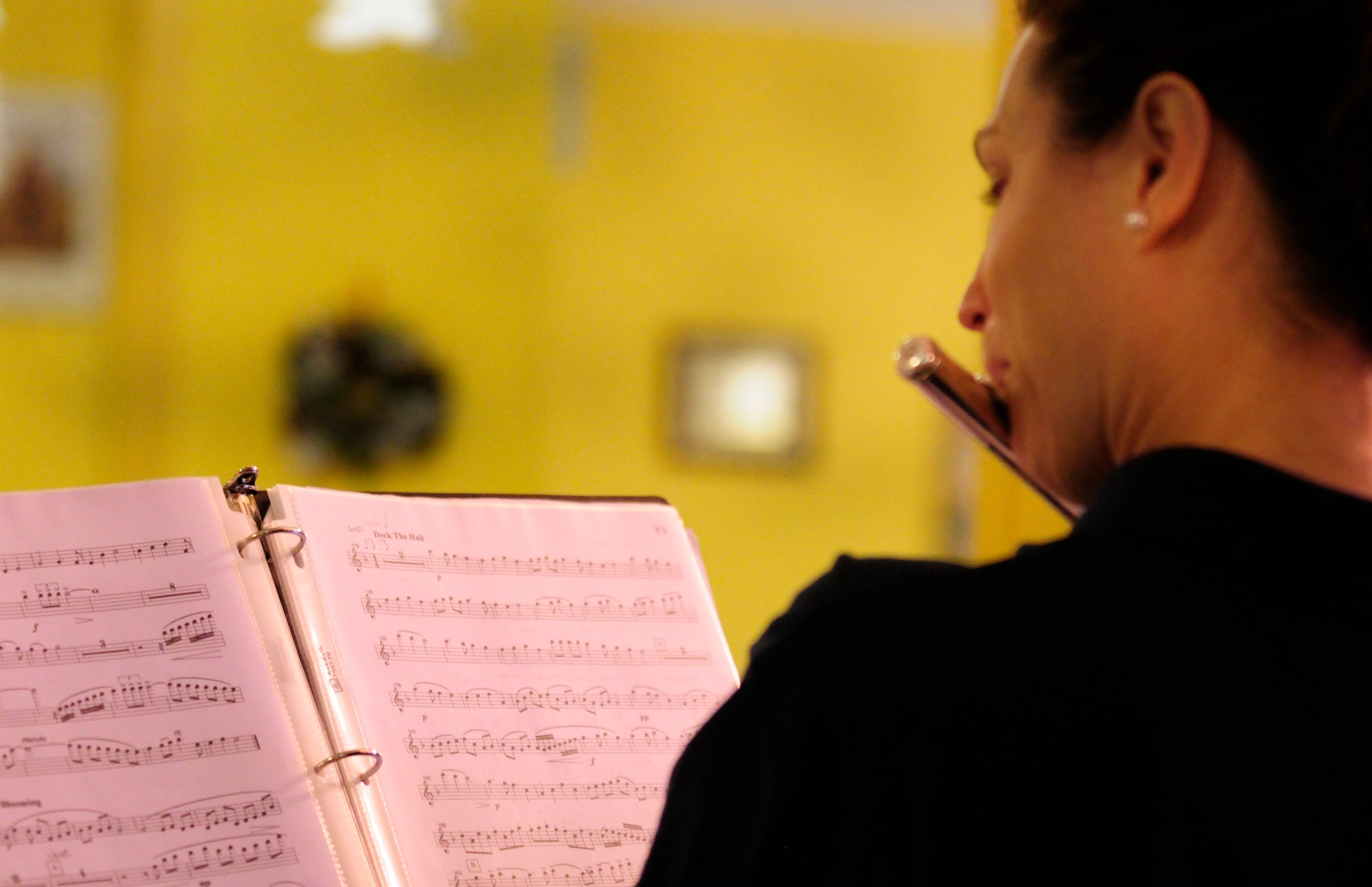 Tech. Sgt. Shannon Dooley, U.S. Air Forces in Europe Band Winds Aloft Woodwind quintet member, plays "Deck the Halls" Dec. 16 at a nursing home in San Quirino, Italy. USAFE band members played holiday music for Team Aviano and local community members as part of a community relations tour celebrating the holidays. (U.S. Air Force photo/Airman 1st Class Briana Jones)