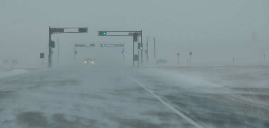 Severe weather hit Kirtland Air Force Base last week, resulting in low visibility, snow-covered roads and icy sidewalks.  U.S. Air Force Photo by Ken Moore