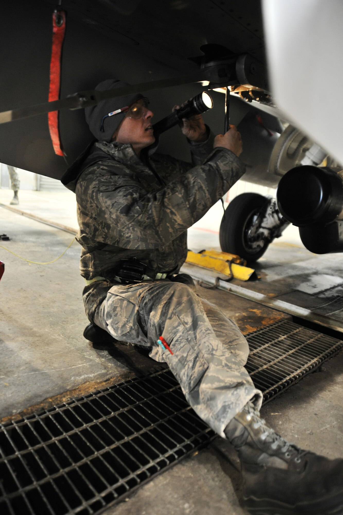 Staff Sgt. Myron Spurlock, 8th Aircraft Maintenance Squadron crew chief, removes a shear bolt on an F-16 Fighting Falcon before an engine run test at Kunsan Air Base, Republic of Korea, Dec. 15. 2011. Spurlock was one of three Airmen who received training on the proper way to perform an engine run test this past week from the 8th Maintenance Operations Squadron maintenance training flight. (U.S. Air Force photo by Senior Airman Brittany Y. Auld/Released)