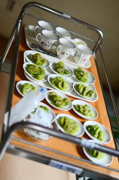 Fruit dishes sit ready to be eaten as members of the Wolf Pack assist residents of the Heart of Jesus Senior Care elderly home for many things, including hanging Christmas decorations during their visit there for a Christmas celebration in Gunsan City, Republic of Korea, Dec. 10, 2011. The senior center was host to many smiles, cake, joint decorating and singing classic Christmas carols. (U.S. Air Force photo by Senior Airman Derrick Schwieters/Released)