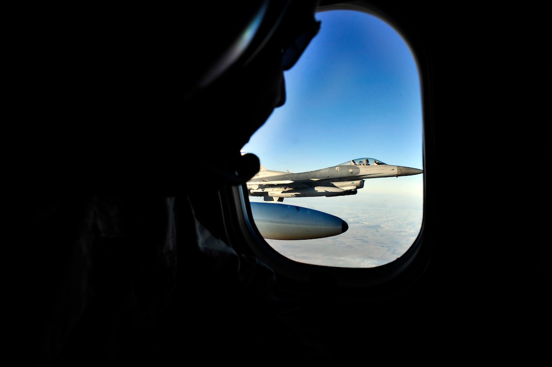 A F-16 from the 140th Fighter Wing, Buckley Air National Guard Base, CO, guides a C-21 from the 458th Airlift Squadron, Scott Air Force base, Ill Dec. 13 during Felix 12-4, a Western Air Defense Sector exercise.  The short notice exercise involved two scenarios, one where the two C-21 pilots were unconscious and another where the plane had been hijacked with no radio contact. In both scenarios the F-16 intercepted the C-21 over Colorado to guide them home. (U.S. Air Force photo/ Staff Sgt. Stephenie Wade)