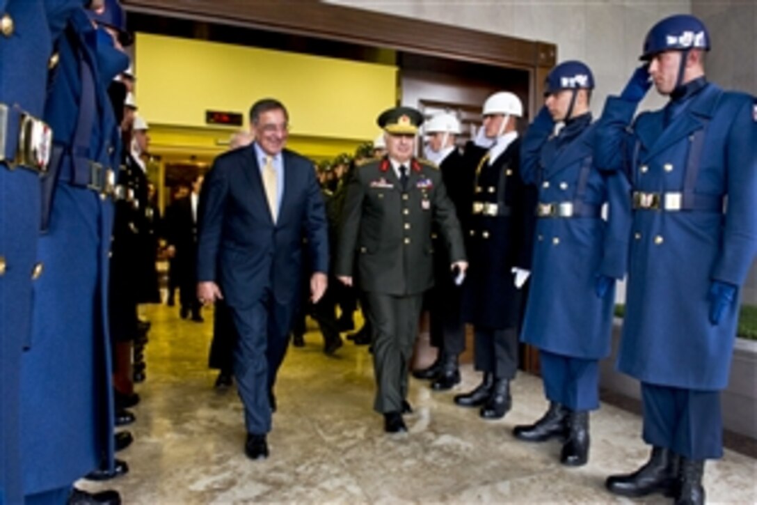 U.S. Defense Secretary Leon E. Panetta walks through an honor cordon with Turkish Chief of General Staff Gen. Necdet Özel in Ankara, Turkey Dec. 16, 2011.