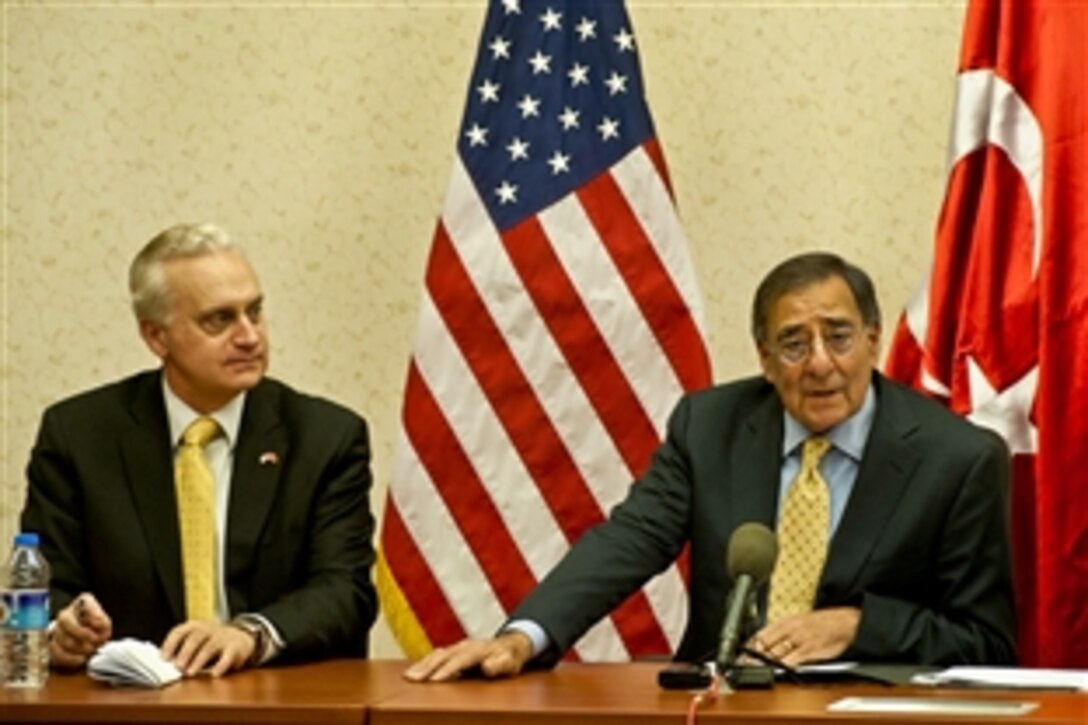 U.S. Defense Secretary Leon E. Panetta participates in a press briefing with U.S. Amassador to Turkey Francis J. Ricciardone Jr. in Ankara, Turkey, Dec. 16, 2011. Panetta answered questions regarding NATO's position on Syria and intelligence drone flights.