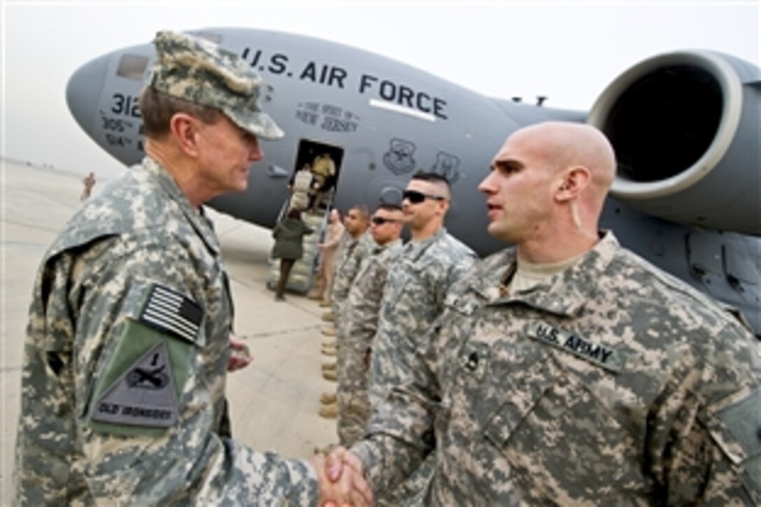 U.S. Army Gen. Martin E. Dempsey, chairman of the Joint Chiefs of Staff, shakes hands with soldiers before departing Baghdad International Airport, Dec. 15, 2011.