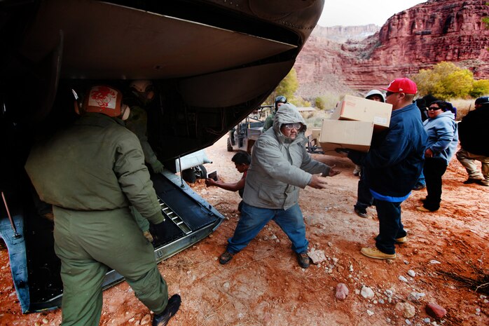 The toy boxes are loaded onto the CH-46E Sea Knight helicopter from the Medium Helicopter Squadron 764 (the Moonlighters), 4th Marine Aircraft Wing, and are going to be distributed to the children durinng Operation Havasupai, Dec.14. The Moonlighters flew into Supai Village, Ariz., carrying toys, supplies and Santa Claus. The five airdrops completed by the Moonlighters were part of the Operation Havasupai, a collaboration of the Marine Corps Reserve and Toys for Tots program to help out people of the isolated Native American village located within the Grand Canyon.