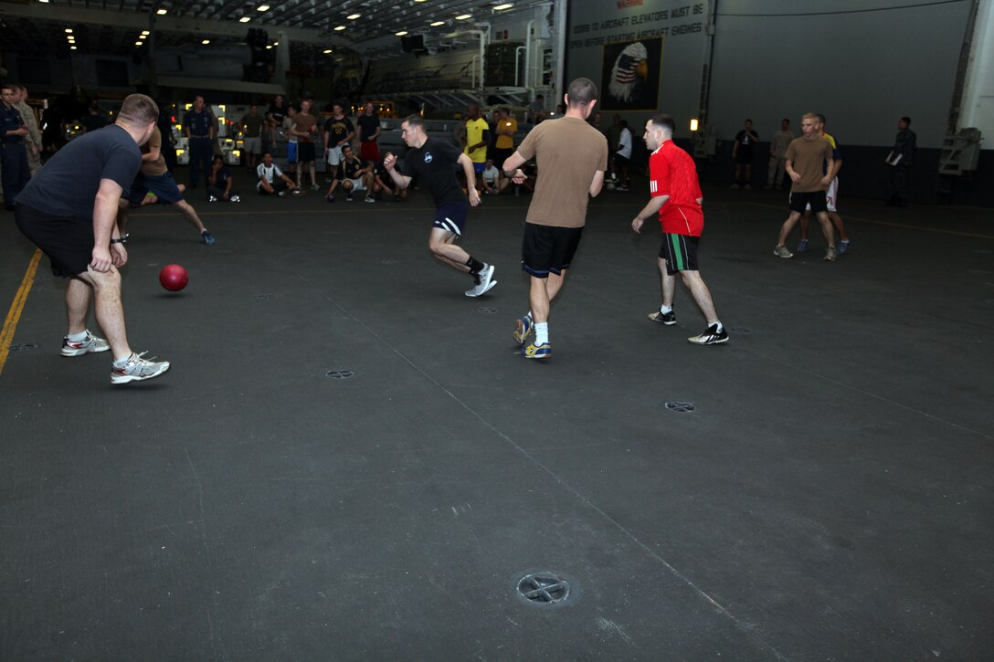 Marines and Sailors, with the 22nd Marine Expeditionary Unit (MEU), and multipurpose amphibious assault ship USS Bataan (LHD 5), compete for bragging rights in a four-on-four soccer tournament aboard the Bataan, Dec. 16, 2011.  Morale, welfare and recreation (MWR) coordinated the tournament to boost morale on ship.  The 22nd MEU is currently deployed as part of the Bataan Amphibious Ready Group (BATARG) as the U.S. Central Command theater reserve force, also providing support for maritime security operations and theater security cooperation efforts in the U.S. 5th Fleet area of responsibility.