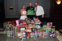 Staff Sgt. Eric M. Svedahl, 33, from Prior Lake, Minn., accepts a Christmas donation from Molly Schaefer and Nick Johnson during their wedding reception at the Grand Hotel Minneapolis Dec. 17. Instead of wedding gifts, the bride and groom asked everyone to bring a present for Toys for Tots. Overall, the newlyweds collected more than 100 donations. Svedahl is a recruiting support staff non-commissioned officer with Recruiting Station Twin Cities. For additional Toys for Tots imagery, visit www.facebook.com/rstwincities.