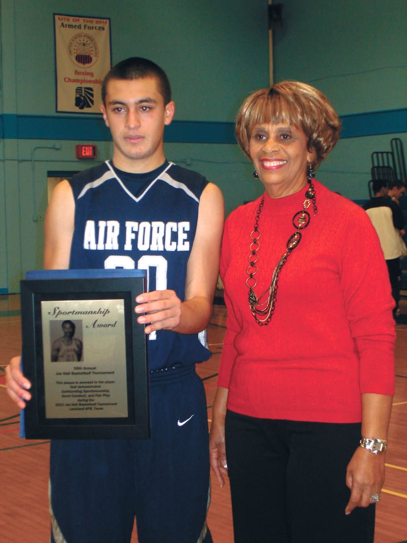 U.S. Air Force Academy Preparatory School point guard and San Antonio native Cole Martinez receives the Joe Hall Sportsmanship award from Mabel Hall. (Courtesy photo)