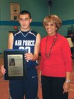 U.S. Air Force Academy Preparatory School point guard and San Antonio native Cole Martinez receives the Joe Hall Sportsmanship award from Mabel Hall. (Courtesy photo)