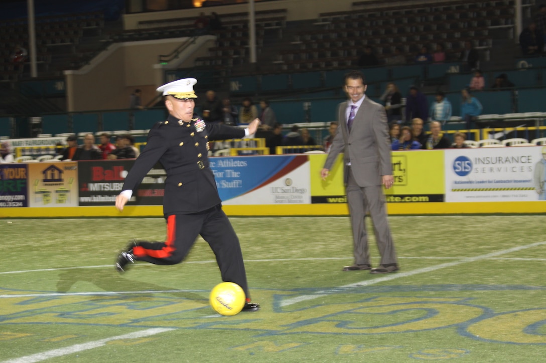 Brig. Gen. Daniel D. Yoo, commanding general, Marine Corps Recruit Depot San Diego and the Western Recruiting Region,makes the first kick during the San Diego Sockers' military appreciation night at Del Mar Arena, Del Mar, Calif. Dec. 17. John P. Kentera, general manager, Sockers, exclaimed the great respect the Sockers have for the military and that an appreciation night can be expected every year.