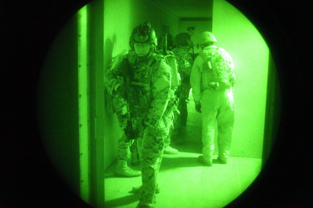 A Marine with Force Reconnaissance Platoon, 31st Marine Expeditionary Unit, provides security as his team secures a building during a simulated raid, Dec. 17. The raid was conducted as part of Realistic Urban Training Exercise, a semiannual training event done to increase interoperability for the MEU’s upcoming deployment. The 31st MEU is the only continuously forward-deployed MEU and remains the nation’s force in readiness in the Asia-Pacific region.