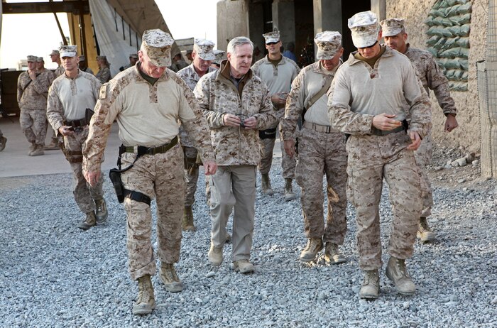 Secretary of the Navy Ray Mabus toured Forward Operating Base Nolay with various senior leaders from Regional Command Southwest, Dec. 18. Brig. Gen. Michael Dana, the commanding general of the 2nd Marin Logistics Group (Forward), gave Mabus a tour of the various logistics lots and facilities on Nolay, offering an assessment of the 2nd MLG's progress in retrograde operations. (U.S. Marine Corps Photo by Cpl. Michael Augusto)