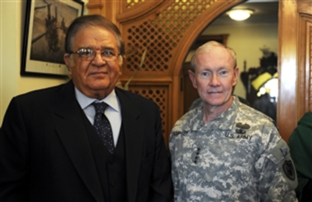 U.S. Army Gen. Martin E. Dempsey, chairman of the Joint Chiefs of Staff, right, meets with Afghanistan Minister of Defense Abdul Rahim Wardak in Afghanistan, Dec. 17, 2011. Dempsey is on a USO tour, visting with troops and meeting with defense leaders. 