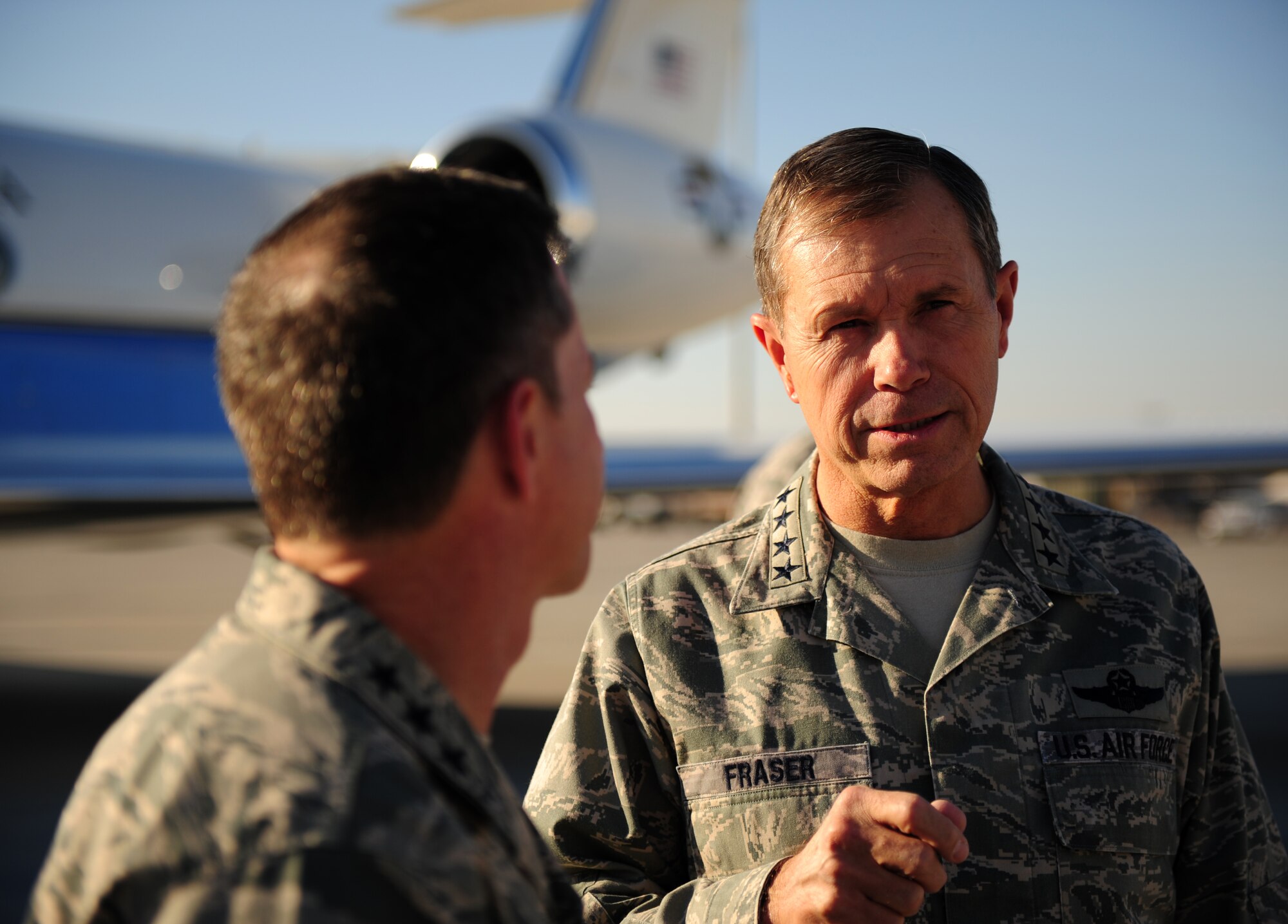 SOUTHWEST ASIA – U.S. Air Force Gen. William M. Fraser III, U.S. Transportation Command commander, speaks with Lt. Gen. David L. Goldfein, U.S. Air Forces Central Command commander, after landing  at an undisclosed location in Southwest Asia Dec. 16. This is Fraser's first visit to the 379th Air Expeditionary Wing since he became USTRANSCOM commander in October. (U.S. Air Force photo/Staff Sgt. Nathanael Callon)