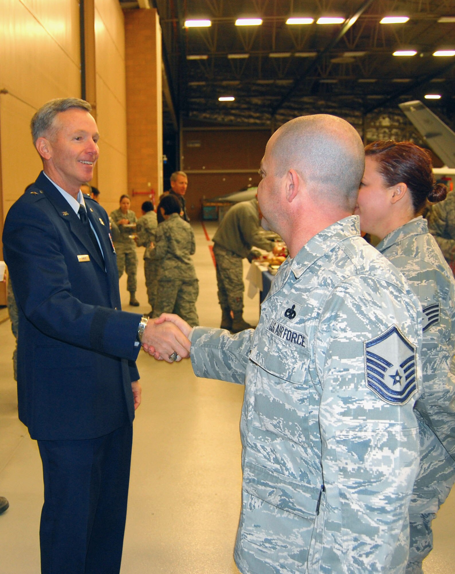 NELLIS AIR FORCE BASE, Nev. (Left) -- Brig. Gen. William Binger, 10th Air Force commander, talks with members of the 926th Group during his visit here Dec. 3. (U.S. Air Force photo/Capt. Jessica Martin)