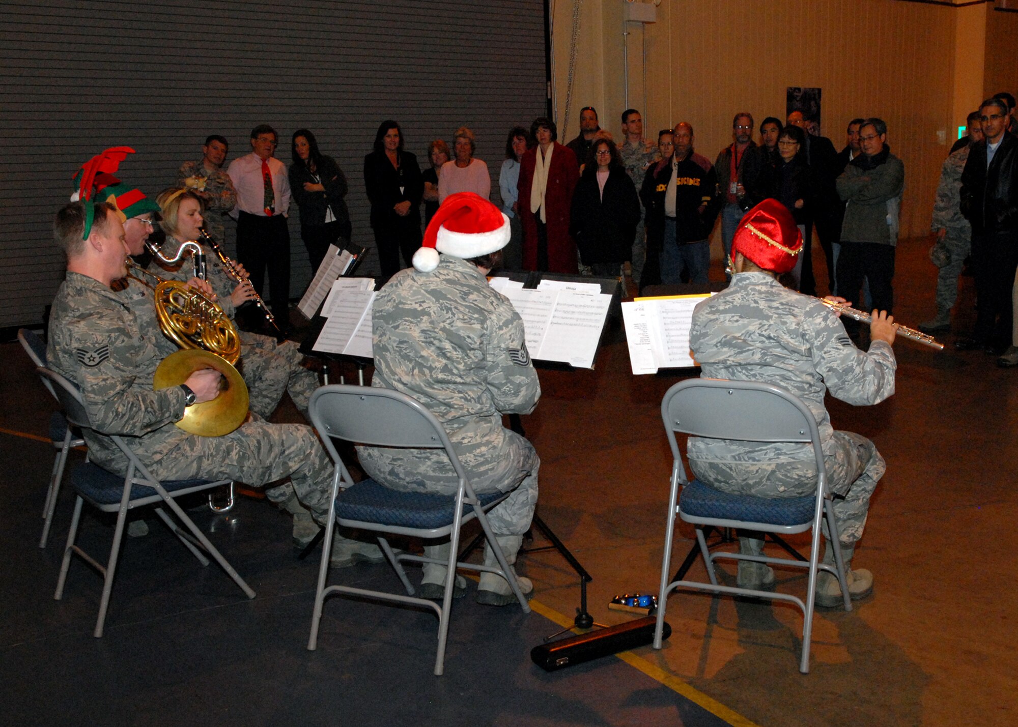 Before The Golden West Winds left base for the day, they made it into the Benefield Anechoic Facility to play holiday favorites for BAF employees. (U.S. Air Force photo by Melissa Buchanan)